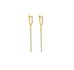 Load image into Gallery viewer, Diamond huggie bar earrings in yellow gold against white background.