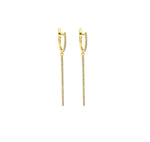 Load image into Gallery viewer, Diamond huggie bar earrings in yellow gold against white background. 
