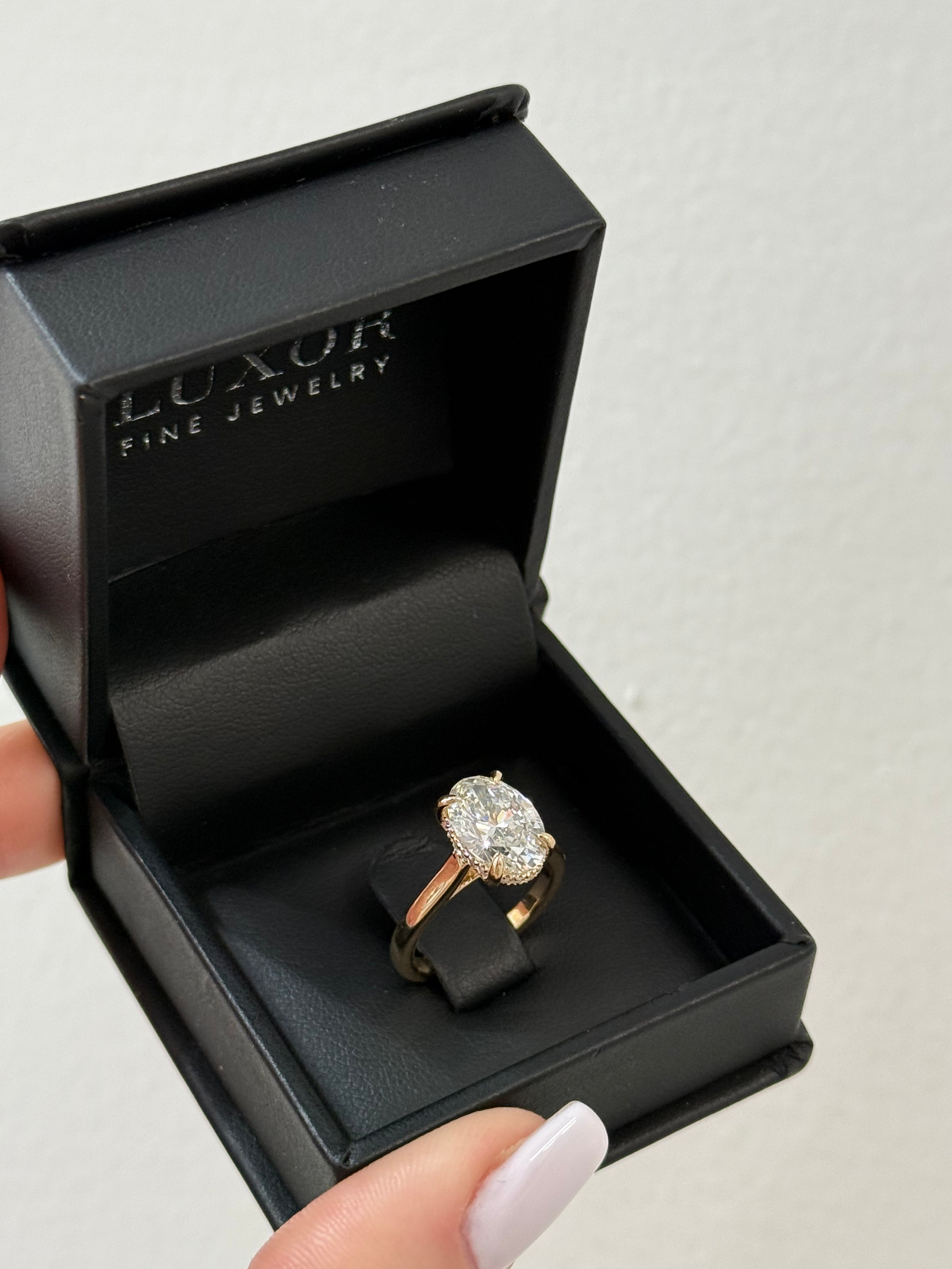 Diamond ring in a black 'Luxor Fine Jewelry' box