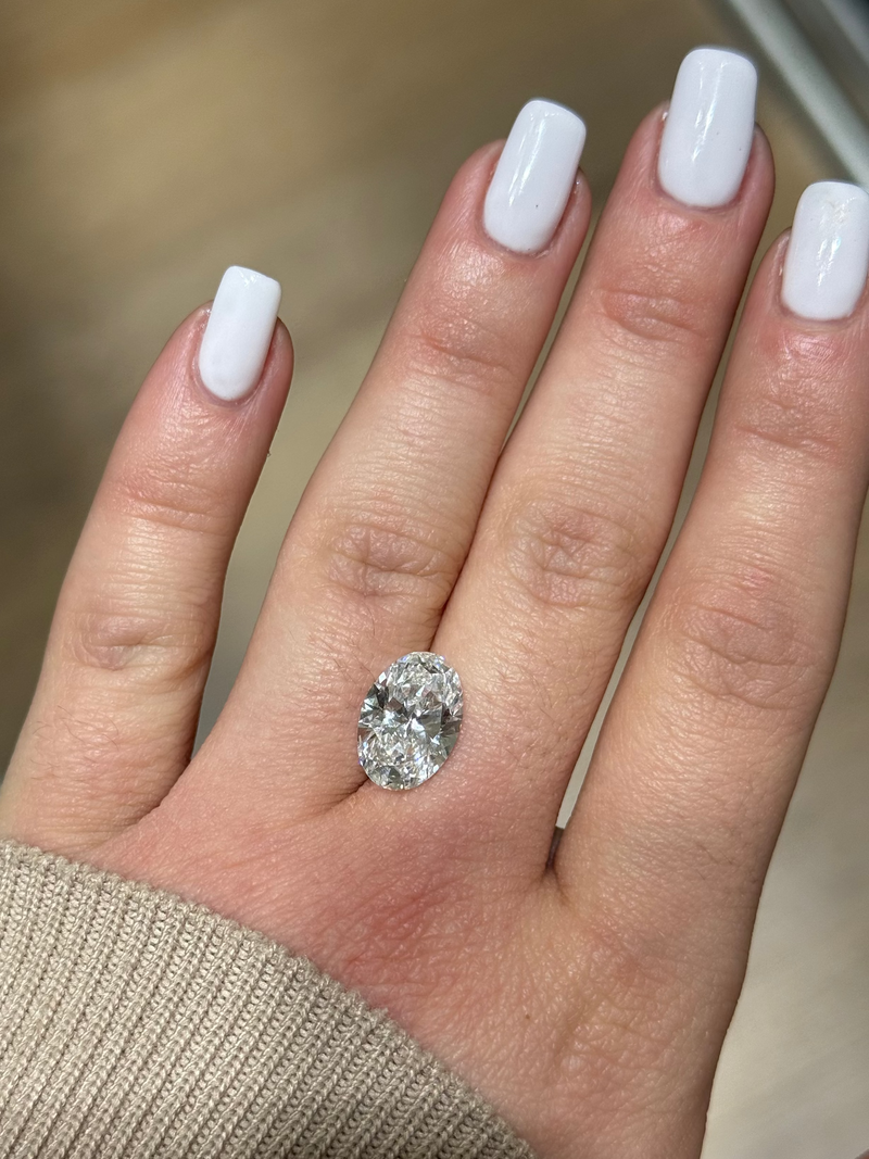 hand showing oval diamond shape laid on fingers 