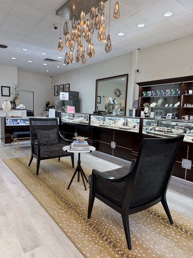 jewelry store interior with showcases and seating area